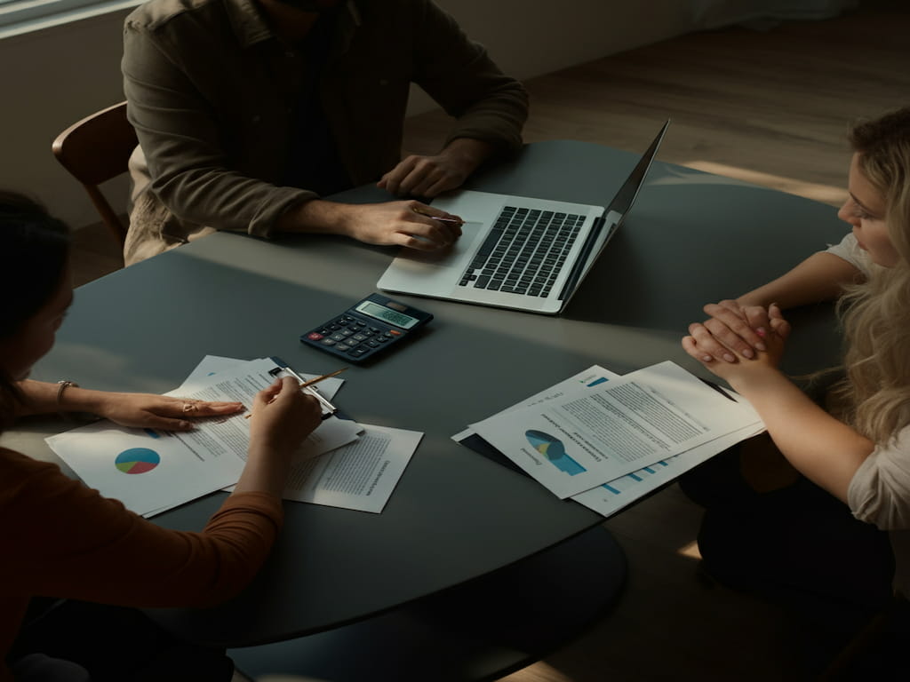 Two people discussing variable-rate mortgages in an office.